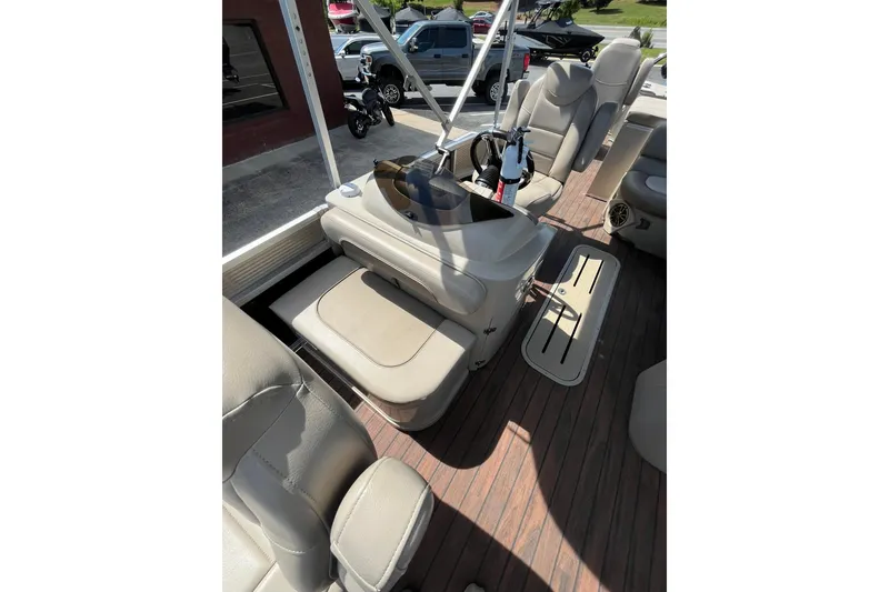 Slide: The Image of Interior of a 2018 Avalon QF-23T boat with beige seating. - 11
