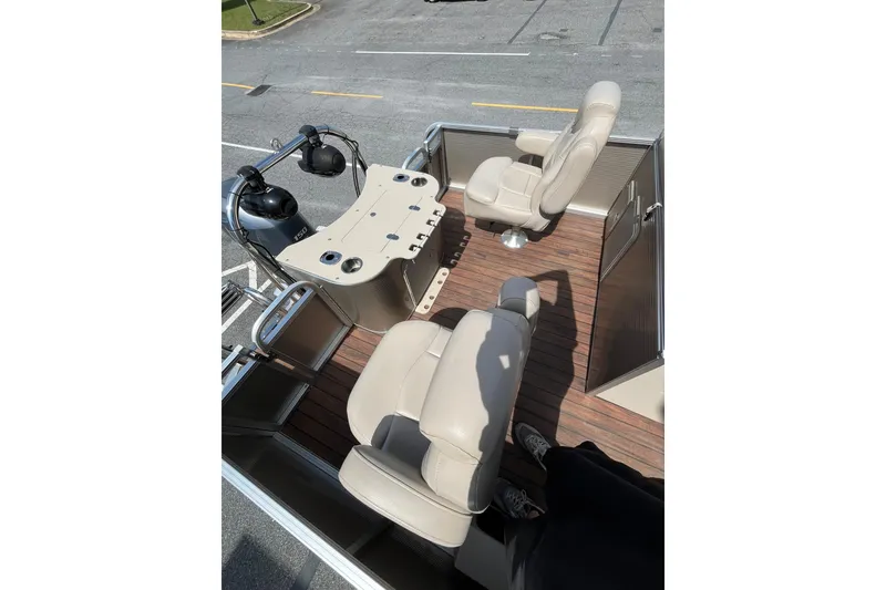 Slide: The Image of Interior of a 2018 Avalon QF-23T boat with beige seats. - 12