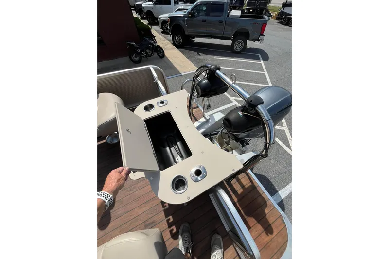 Slide: The Image of 2018 Avalon QF-23T boat console with storage and motor view. - 13