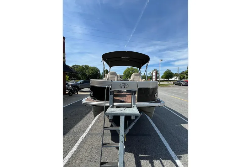 Slide: The Image of 2018 Avalon QF-23T pontoon boat in parking lot under sunny sky. - 3