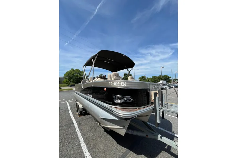 Slide: The Image of 2018 Avalon QF-23T pontoon boat on trailer outdoors. - 5
