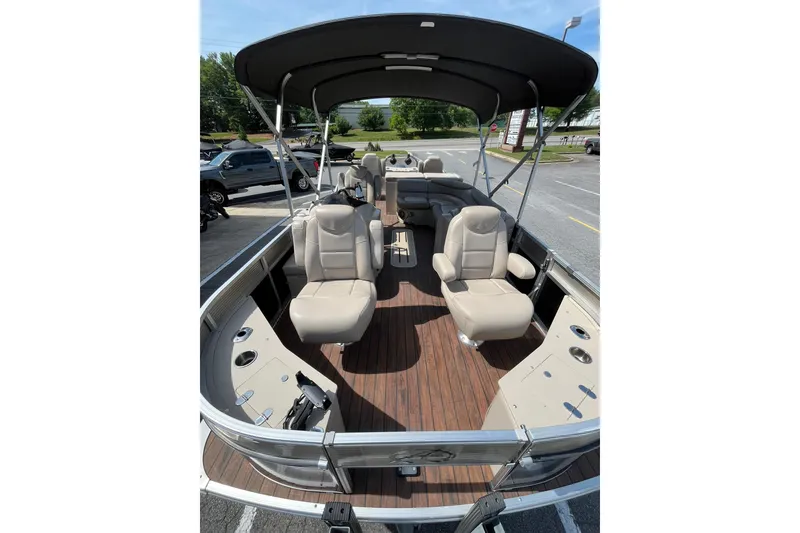 Slide: The Image of 2018 Avalon QF-23T pontoon boat with beige seats and sun canopy. - 9