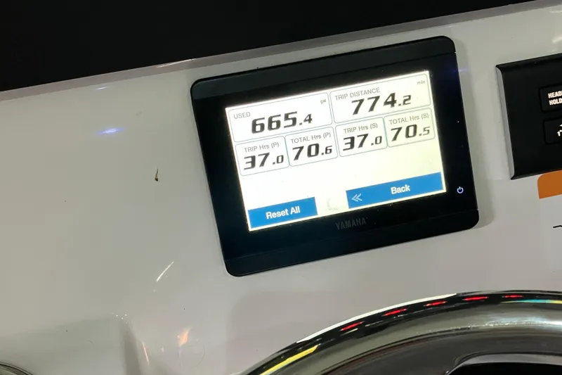 Slide: The Image of Dashboard display of a 2025 Regulator 28 boat showing trip data and engine hours. - 8