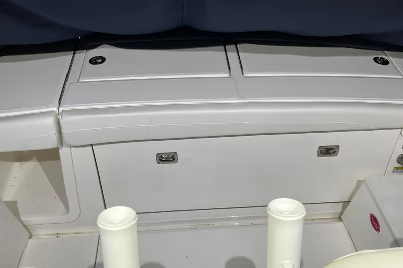 Slide: The Image of 2025 Regulator 28 boat interior with storage compartments and seating. - 3