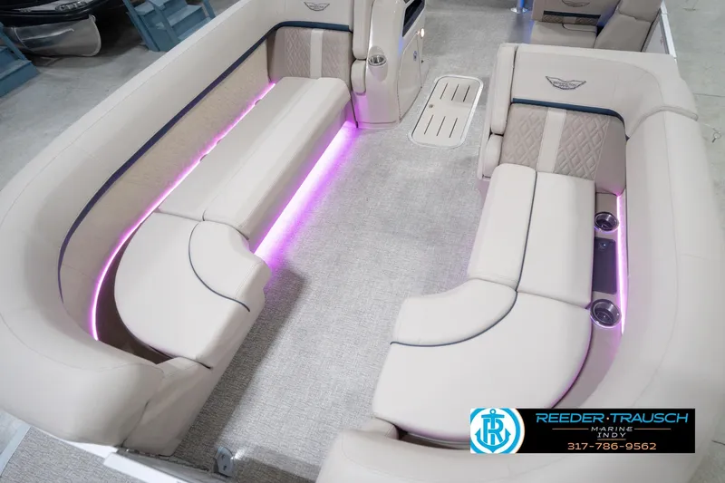 Slide: The Image of Luxurious interior of 2026 Bennington 22 ML pontoon boat with ambient lighting. - 13