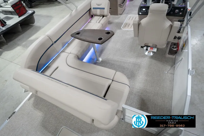 Slide: The Image of 2026 Bennington 22 ML boat interior with beige seating and modern helm. - 16