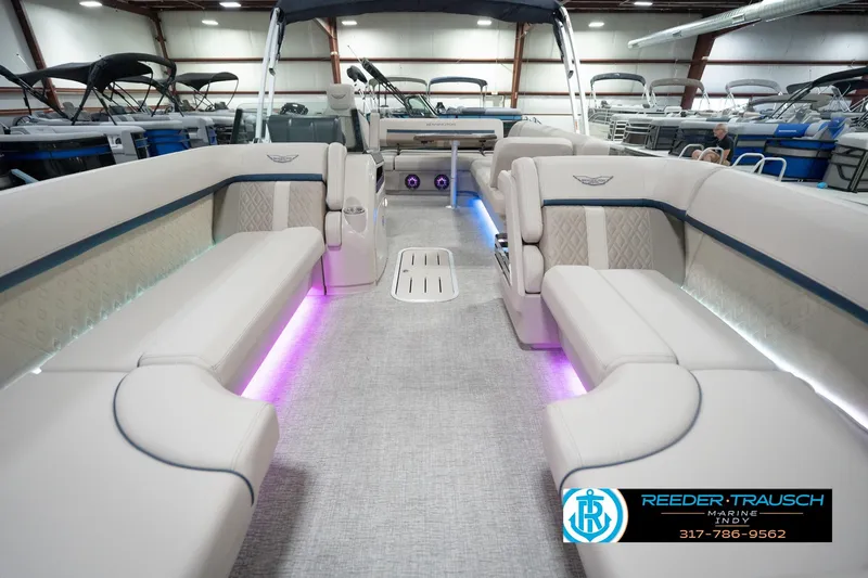 Slide: The Image of Luxurious interior of 2026 Bennington 22 ML pontoon boat with ambient lighting. - 18