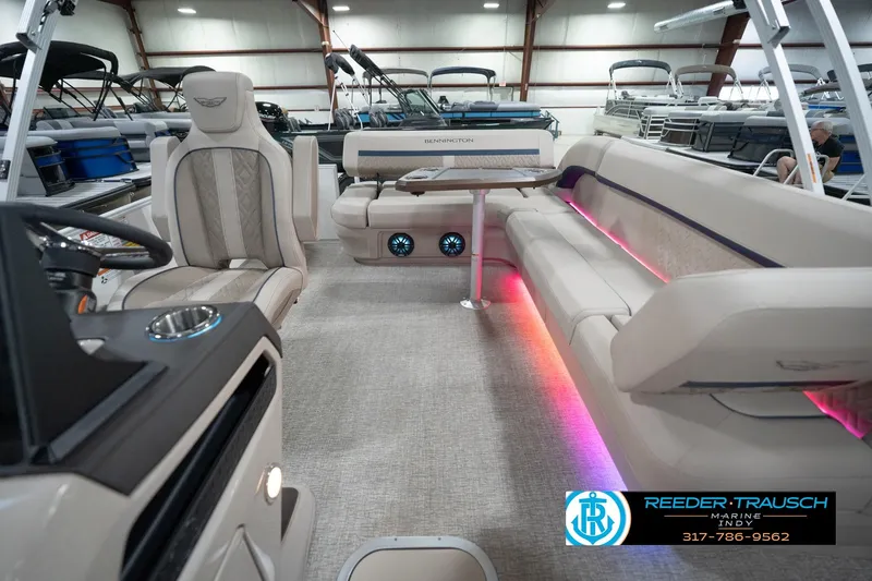 Slide: The Image of 2026 Bennington 22 ML pontoon boat interior with luxurious seating and ambient lighting. - 20