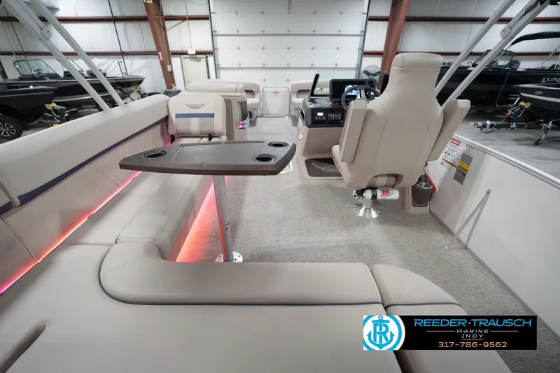 Slide: The Image of Interior of 2026 Bennington 22 ML pontoon boat with seating and control console. - 22