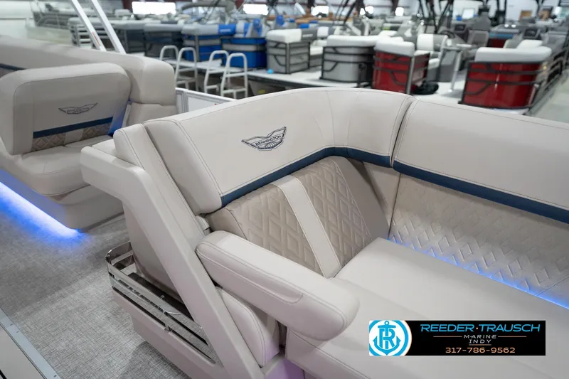 Slide: The Image of 2026 Bennington 22 ML boat interior with luxurious seating and ambient lighting. - 29