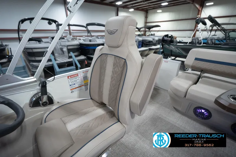 Slide: The Image of 2026 Bennington 22 ML boat interior with luxurious seating in showroom. - 30
