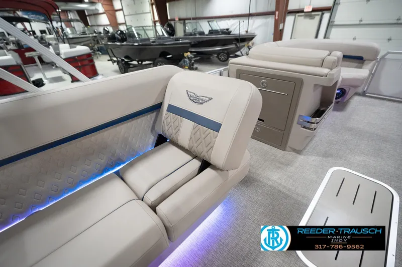 Slide: The Image of 2026 Bennington 22 ML boat interior with luxurious seating and ambient lighting. - 33