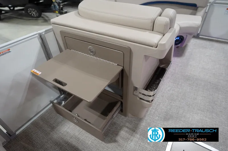 Slide: The Image of 2026 Bennington 22 ML boat interior with storage compartments and seating. - 37