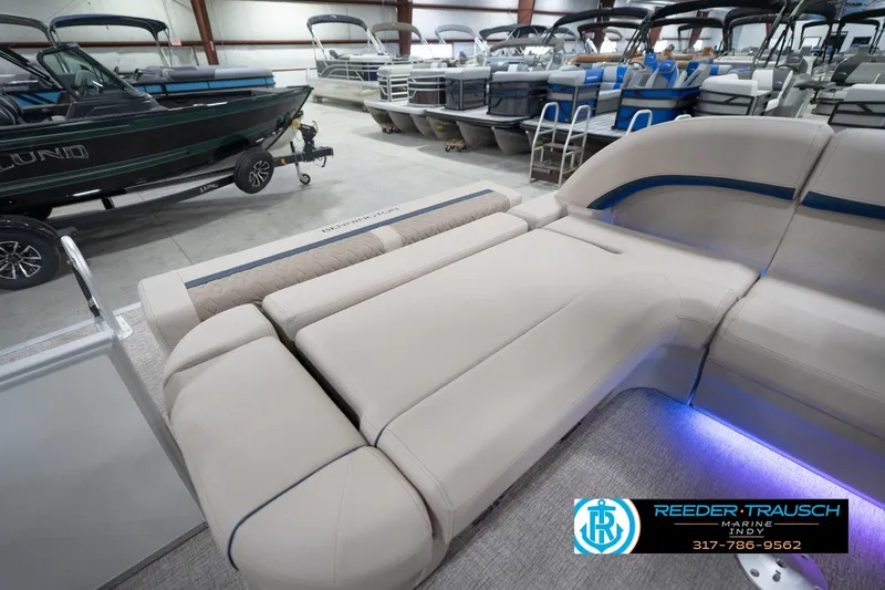 Slide: The Image of Luxurious seating on 2026 Bennington 22 ML pontoon boat in showroom. - 43