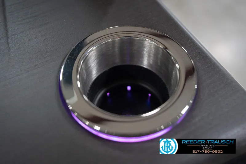 Slide: The Image of Cup holder with LED lighting on 2026 Bennington 22 ML boat, Reeder-Trausch Marine logo visible. - 59