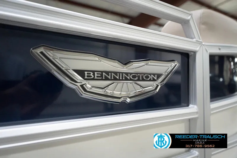 Slide: The Image of 2026 Bennington 22 ML boat emblem with Reeder-Trausch Marine contact details. - 61