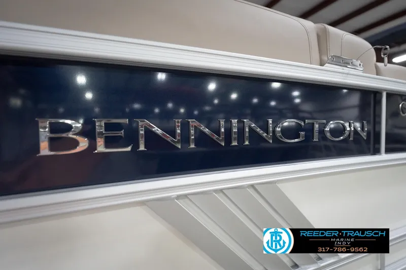 Slide: The Image of 2026 Bennington 22 ML boat with sleek design and metallic logo. - 62