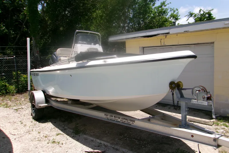The Image of 2022 Key West 1720 Center Console boat on trailer, parked outdoors. - 1