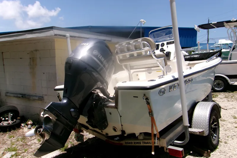 Slide: The Image of 2022 Key West 1720 Center Console boat with Yamaha motor on trailer. - 2