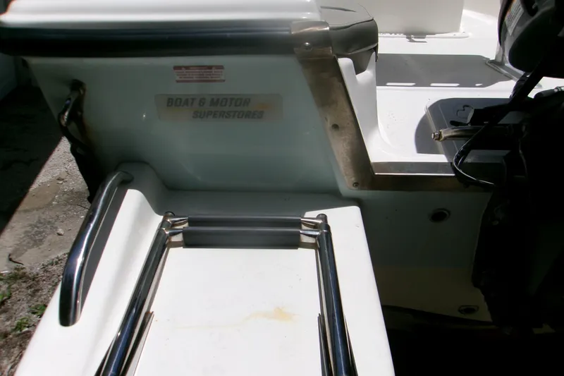 Slide: The Image of 2022 Key West 1720 Center Console boat with stainless steel fittings and motor superstore label. - 3