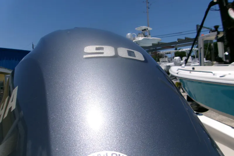 Slide: The Image of Outboard motor on a 2022 Key West 1720 Center Console boat, sunny day. - 4