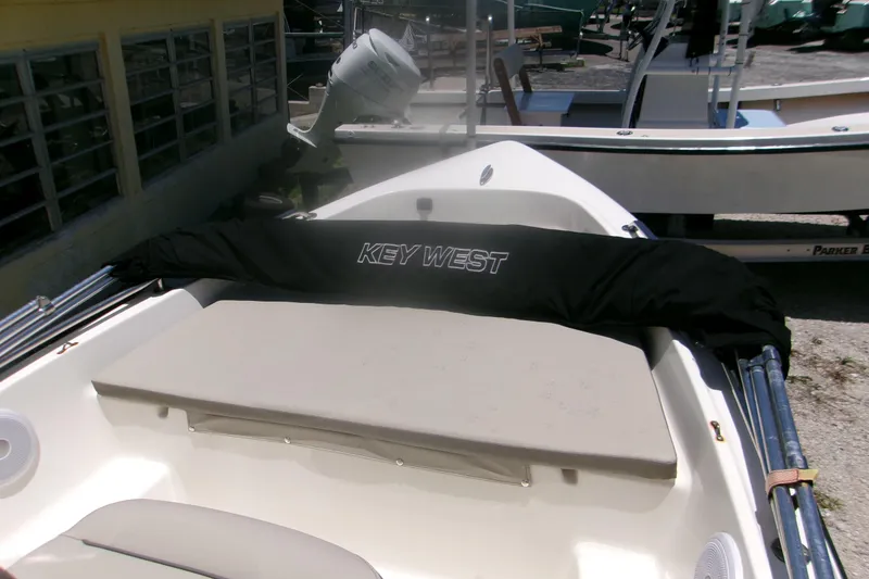 Slide: The Image of 2022 Key West 1720 Center Console boat with cover, docked outdoors. - 5