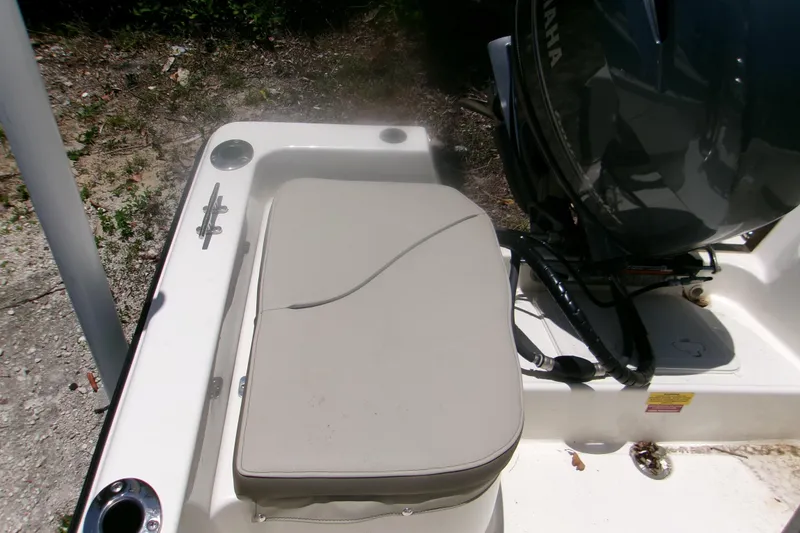 Slide: The Image of 2022 Key West 1720 Center Console boat with Yamaha engine, featuring cushioned seating. - 8