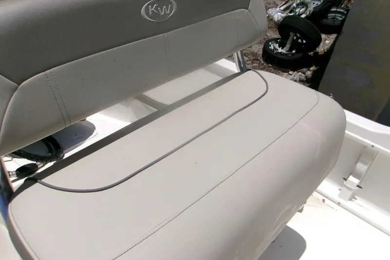 Slide: The Image of 2022 Key West 1720 Center Console boat seat with KW logo, beige upholstery. - 9