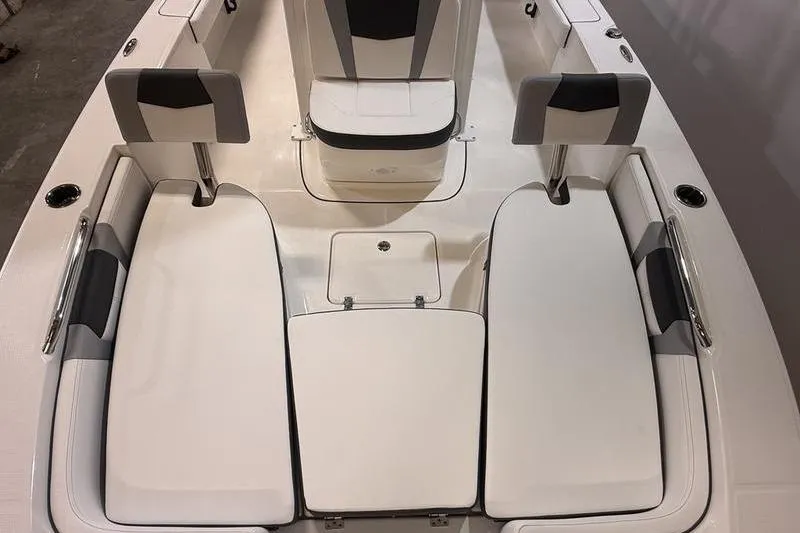 Slide: The Image of 2026 Robalo 226 Cayman boat interior with cushioned seating and sleek design. - 23