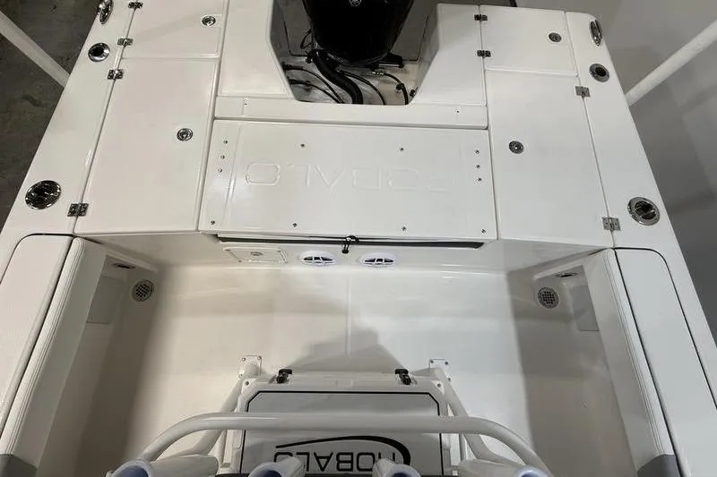 Slide: The Image of 2026 Robalo 226 Cayman boat deck, featuring storage compartments and sleek design. - 5