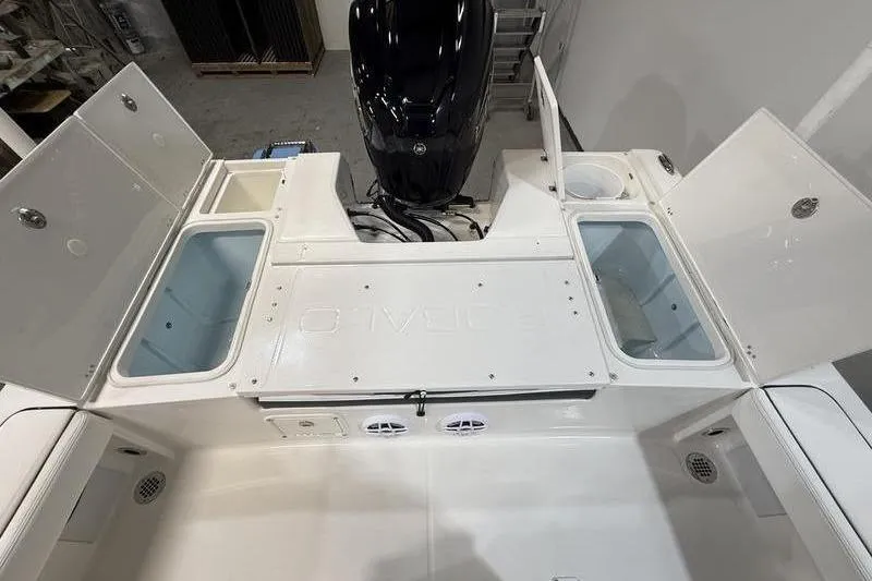 Slide: The Image of Robalo 226 Cayman 2026 boat with storage compartments and engine view. - 6