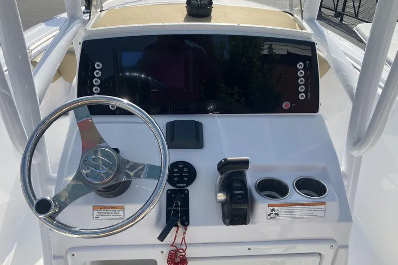Slide: The Image of 2019 Sportsman Heritage 231 Center Console dashboard with steering wheel and controls. - 11
