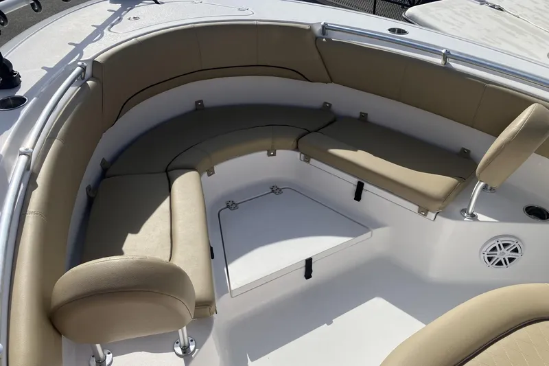 Slide: The Image of 2019 Sportsman Heritage 231 Center Console boat with cushioned seating area. - 12