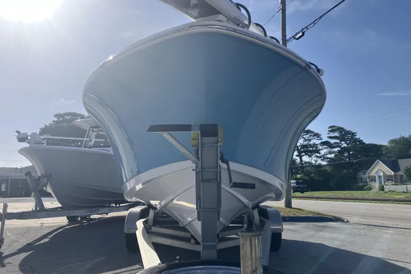Slide: The Image of 2019 Sportsman Heritage 231 Center Console boat on trailer, sunny day. - 3