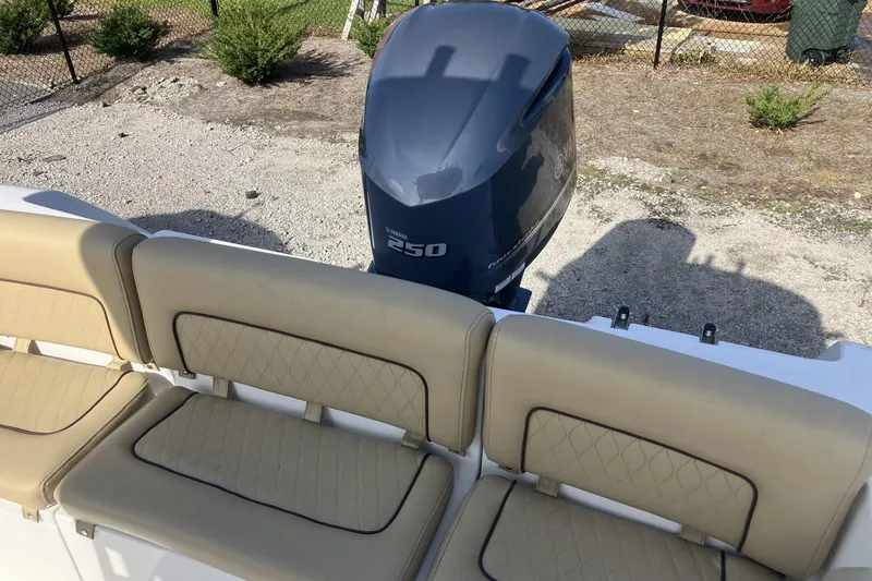 Slide: The Image of 2019 Sportsman Heritage 231 Center Console with Yamaha 250 engine and beige seating. - 8