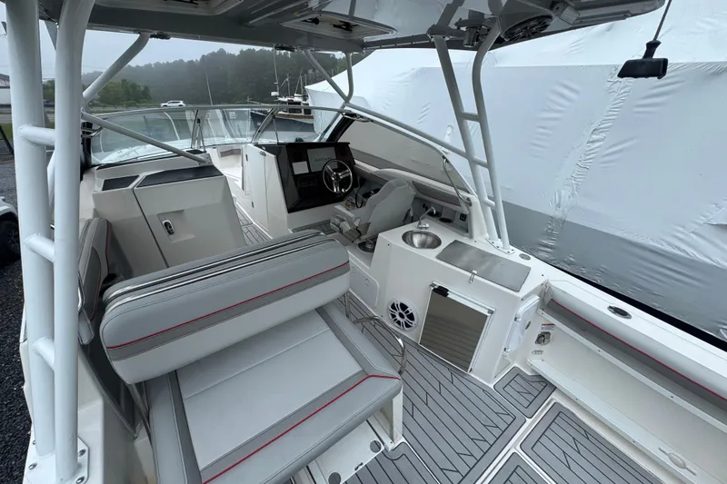 Slide: The Image of 2023 Solara S-250 DC boat interior with modern seating and steering console. - 3