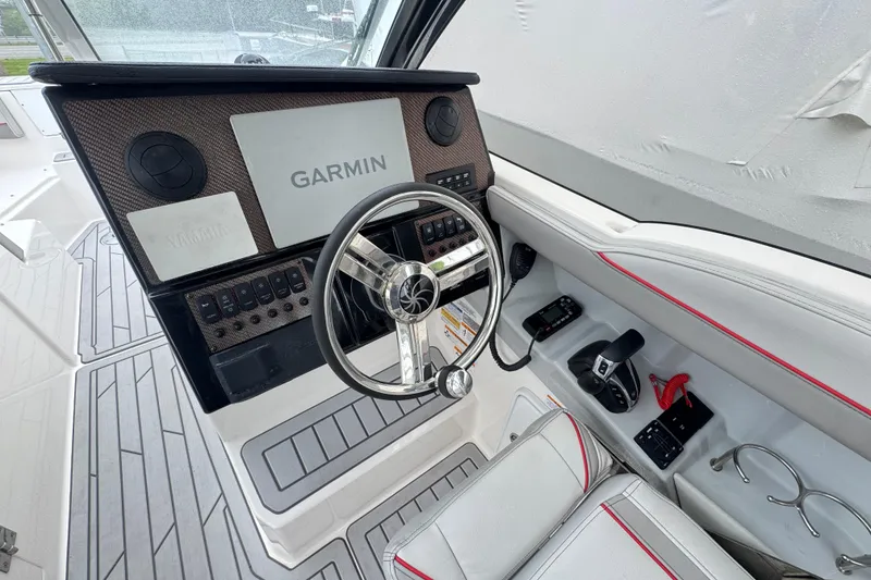 Slide: The Image of 2023 Solara S-250 DC boat cockpit with Garmin navigation system and modern controls. - 6
