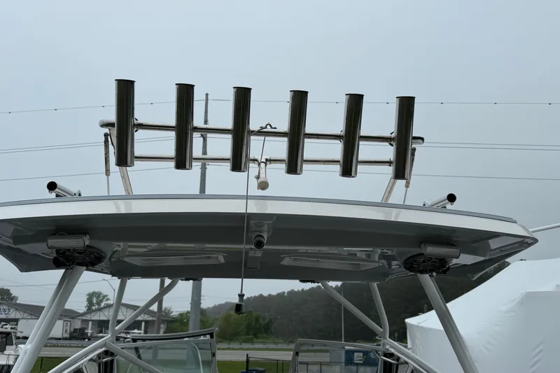Slide: The Image of 2023 Solara S-250 DC boat with rod holders and sleek design. - 8