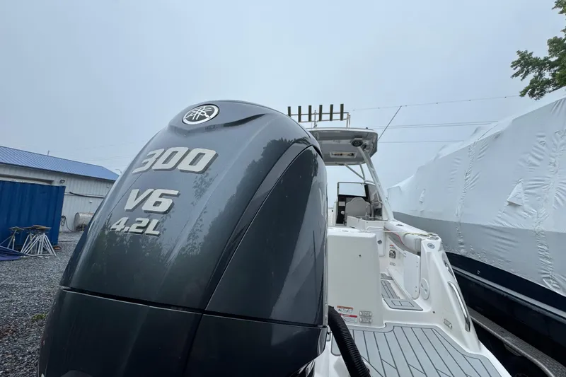 Slide: The Image of 2023 Solara S-250 DC boat with Yamaha 300 V6 4.2L engine in storage. - 9