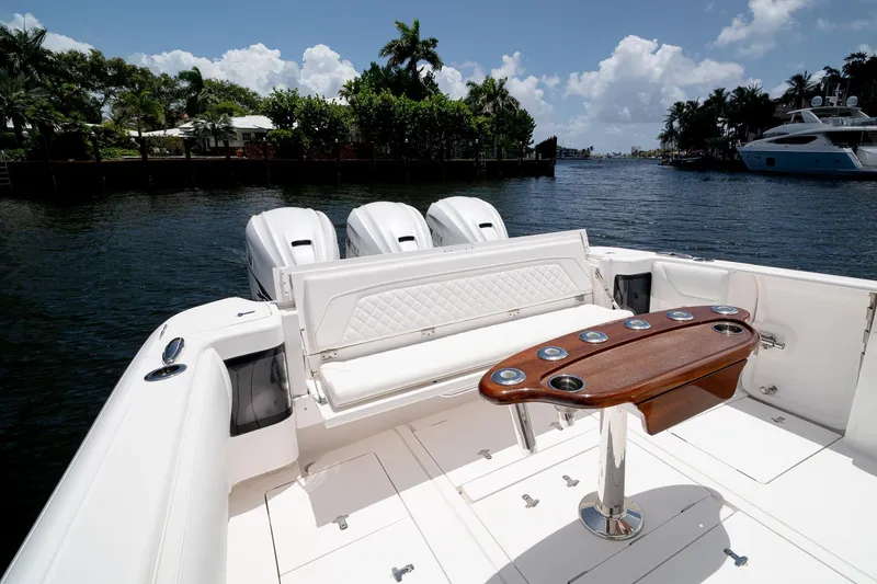 Slide: The Image of 2021 Intrepid 400 Center Console boat with luxurious seating and sleek design on a sunny day. - 10