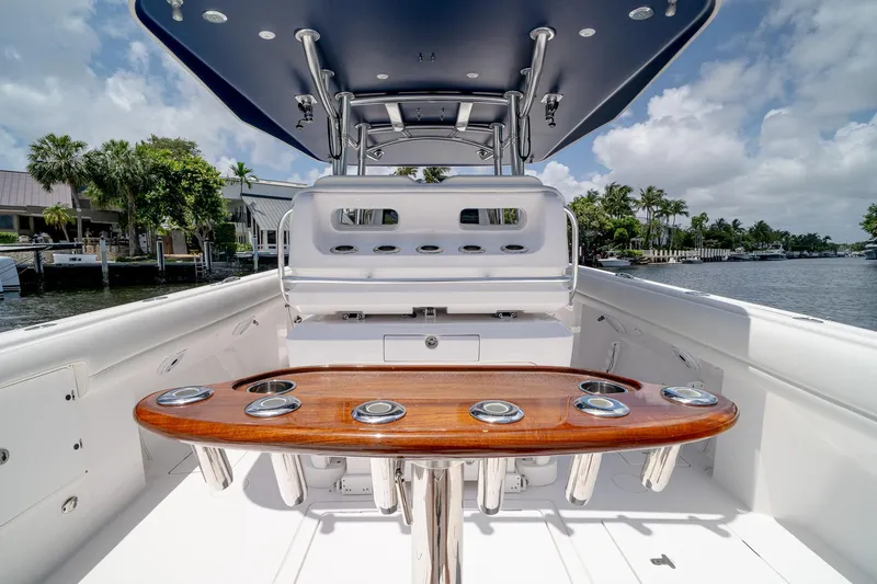 Slide: The Image of 2021 Intrepid 400 Center Console boat interior with sleek design and rod holders. - 17