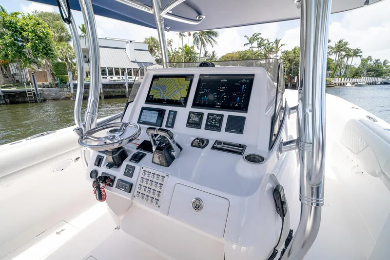 Slide: The Image of 2021 Intrepid 400 Center Console boat dashboard with advanced navigation and control systems. - 21