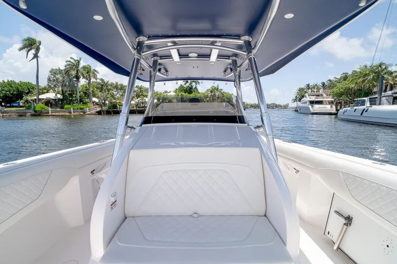Slide: The Image of 2021 Intrepid 400 Center Console boat on a scenic waterway with palm trees. - 29