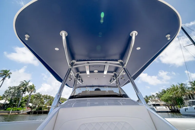 Slide: The Image of 2021 Intrepid 400 Center Console boat with sleek design and spacious canopy. - 30
