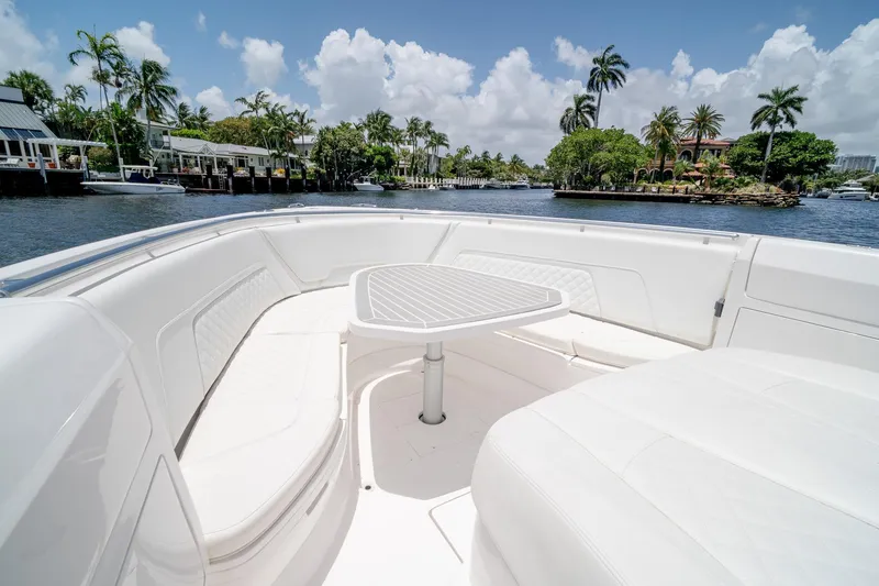 Slide: The Image of Luxurious seating area on 2021 Intrepid 400 Center Console boat, with scenic waterfront view. - 43