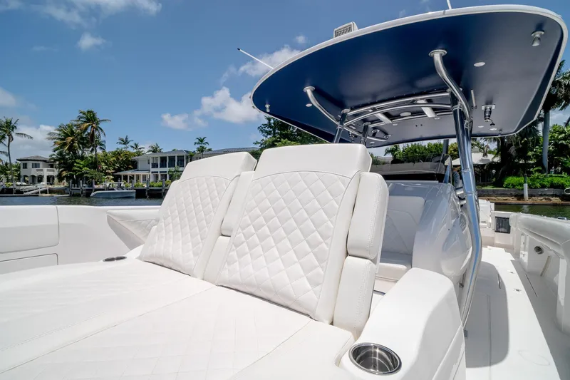 Slide: The Image of 2021 Intrepid 400 Center Console boat with luxurious white seating and sleek design. - 44