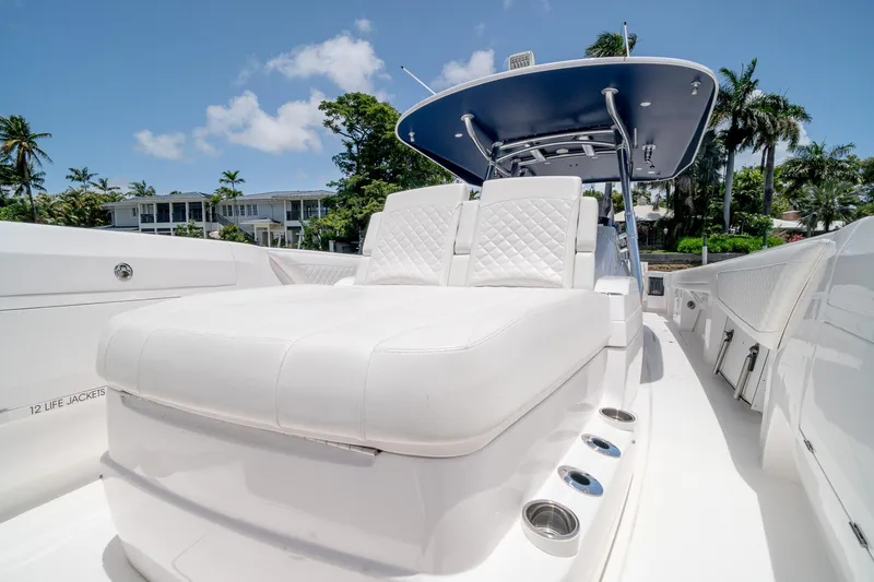 Slide: The Image of 2021 Intrepid 400 Center Console boat with luxurious white seating and sleek design. - 45
