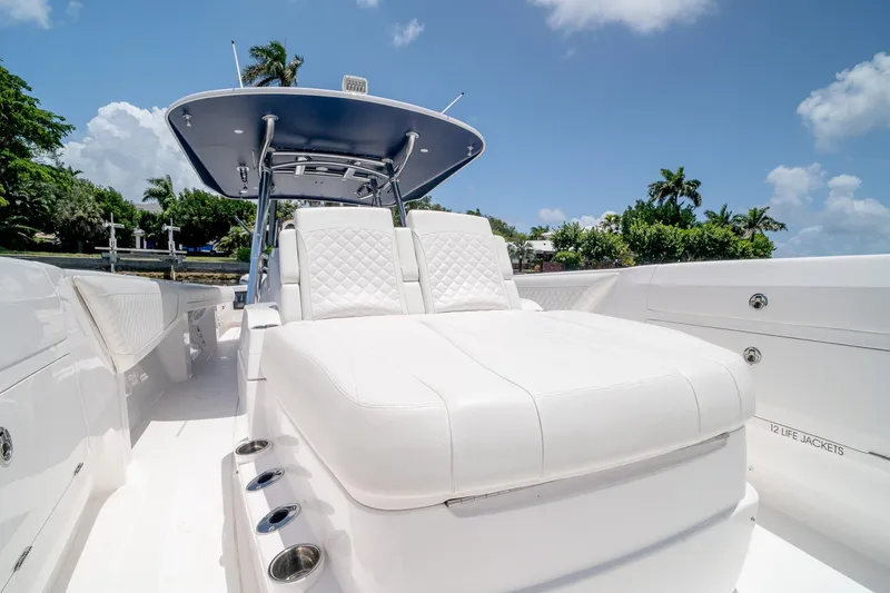 Slide: The Image of 2021 Intrepid 400 Center Console boat with luxurious white seating and sleek design. - 46