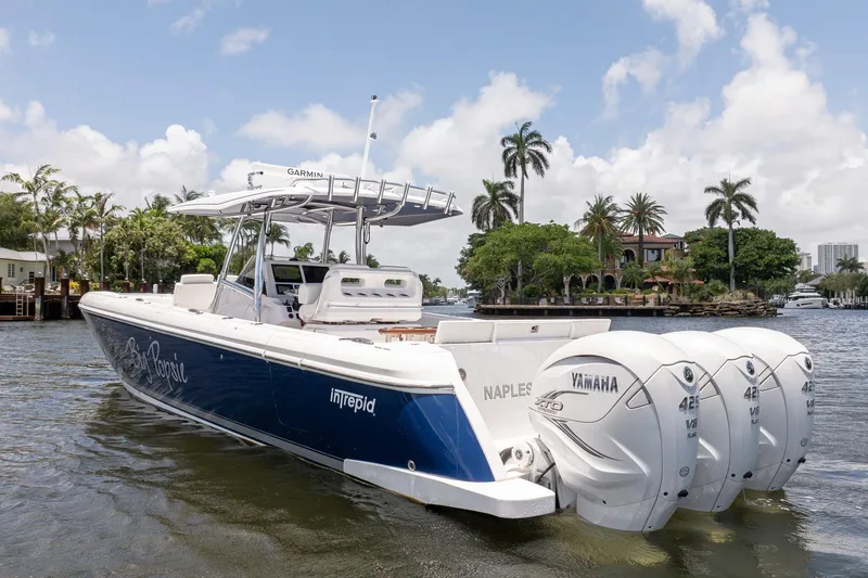 Slide: The Image of 2021 Intrepid 400 Center Console boat with triple Yamaha engines on a sunny day. - 6