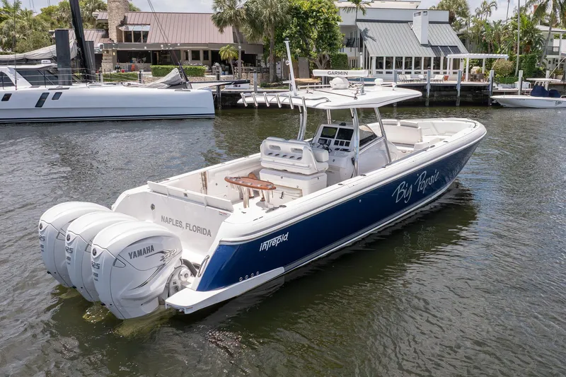 Slide: The Image of 2021 Intrepid 400 Center Console boat with Yamaha engines, docked in Naples, Florida. - 8